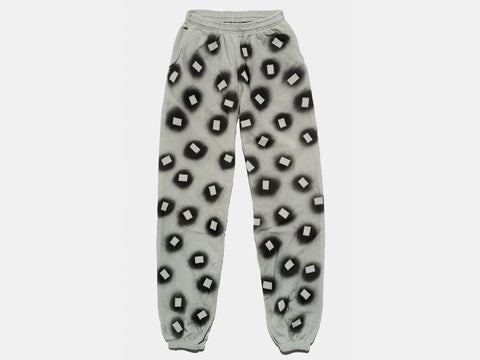 100% cotton sage sweatpants, perfectly cut, with hand-painted, black, negative cut-out squares extending across body and down legs. High-contrast composition really pops. The pattern continues on the other side of the pants.