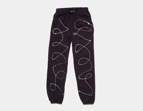 100 % cotton black sweat pants. A drippy, black line run down each leg