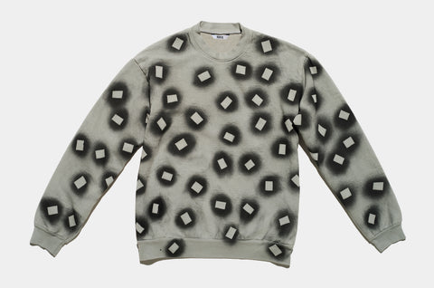 100% cotton sage sweatshirt, perfectly cut, with hand-painted, black, negative cut-out squares extending across body and down sleeves. High-contrast composition really pops. The pattern continues on the other side of the shirt.