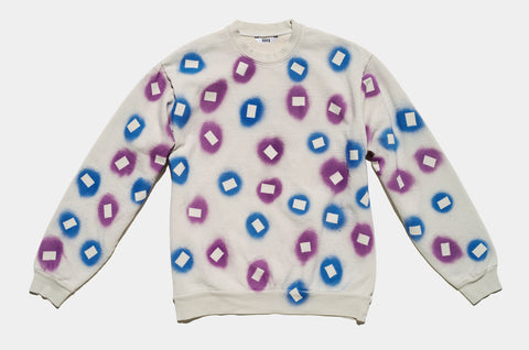100% cotton grey/cement sweatshirt, perfectly cut, with hand-painted, purple and blue negative cut-out squares extending across body and down sleeves. The pattern continues on the other side of the shirt.