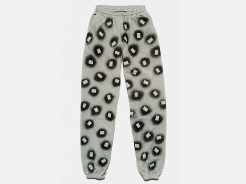 100% cotton sage sweatpants, perfectly cut, with hand-painted, black, negative cut-out squares extending across body and down legs. High-contrast composition really pops. The pattern continues on the other side of the pants. 
