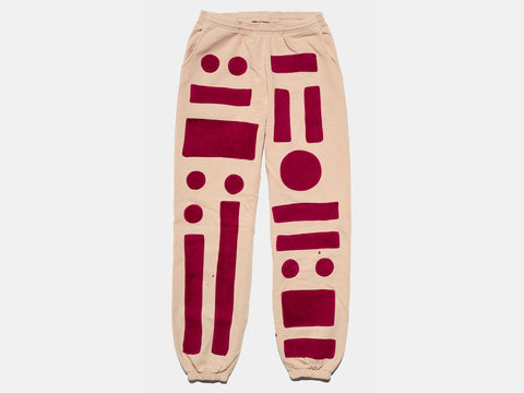 100% cotton peach sweat pants, perfectly cut, with hand-painted, maroon circles, squares and rectangles assembled in a beautiful pattern on both pant legs